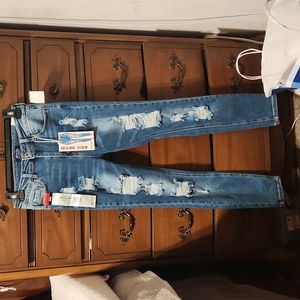 Distress high rise skinny jeans